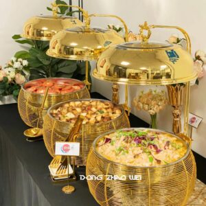 Luxury stainless steel chafing dishes with hinged lid.